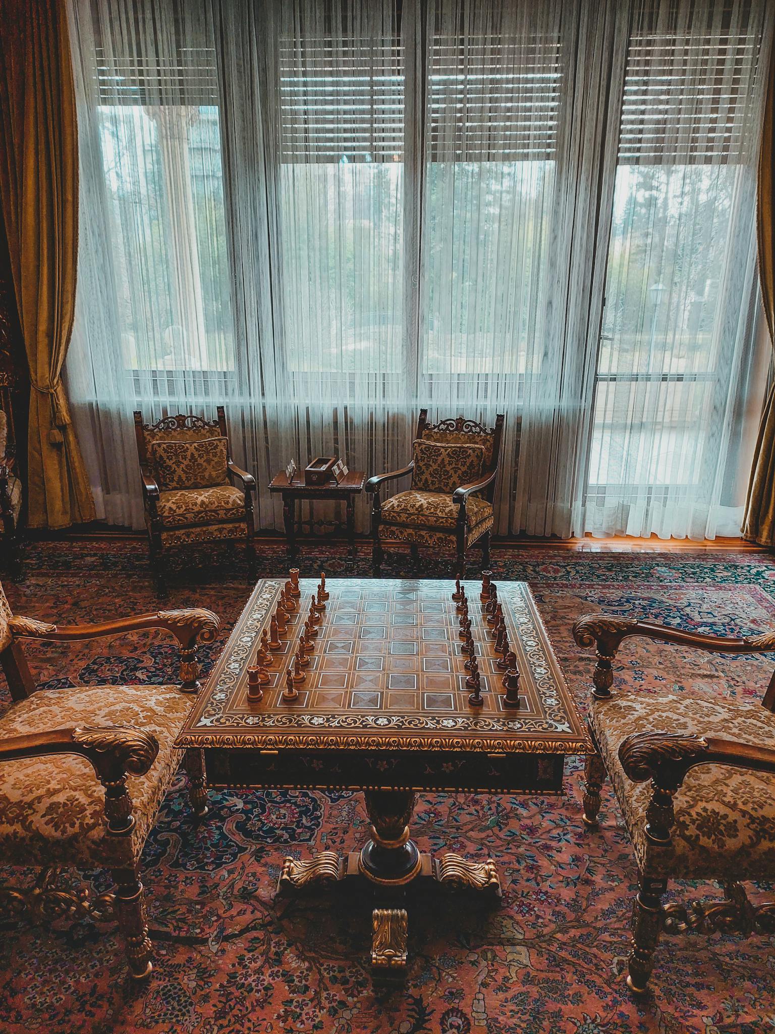 A chess board and chairs in a room